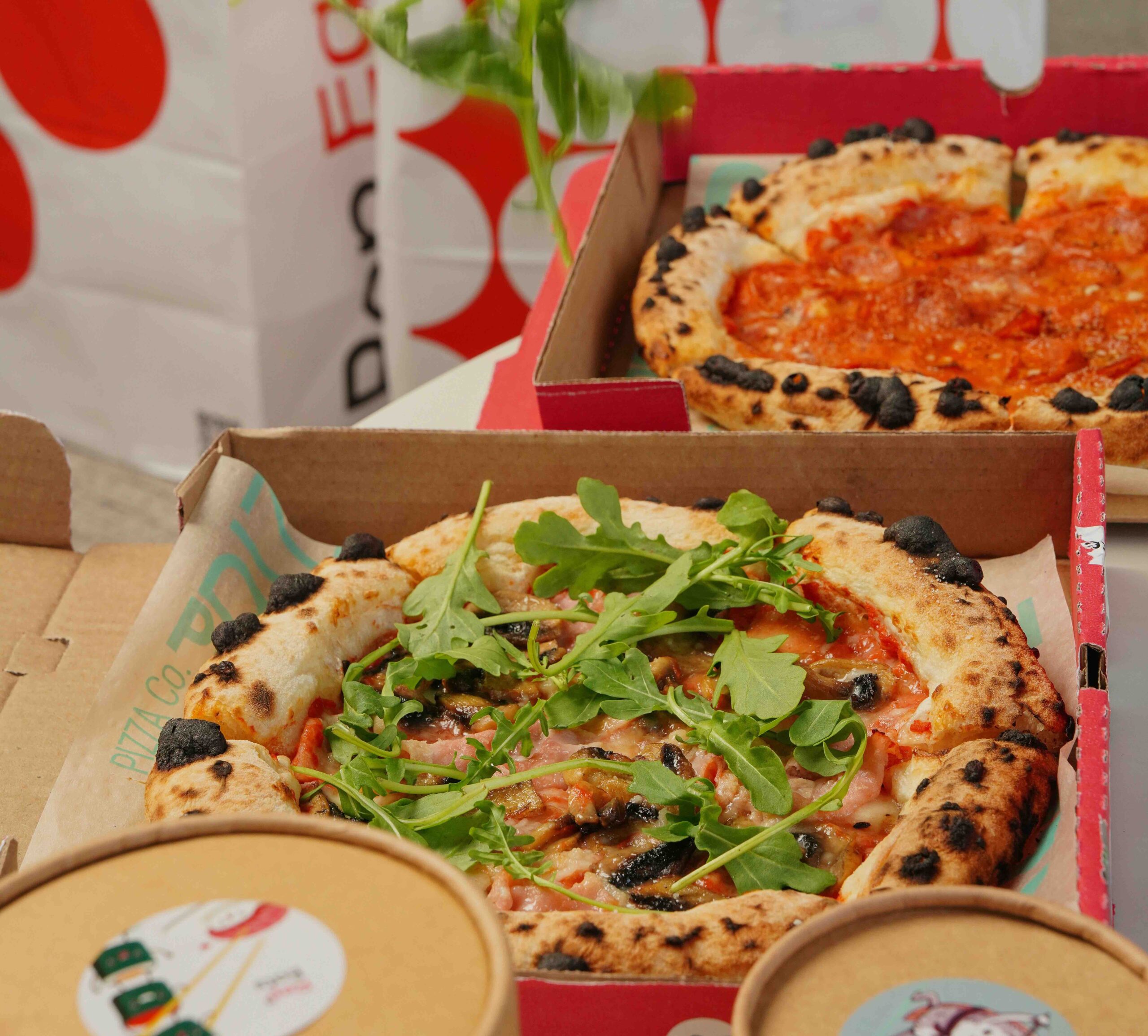 Two boxes of pizza from Ubereats (Low-Cost Wellness Services for Women in London)