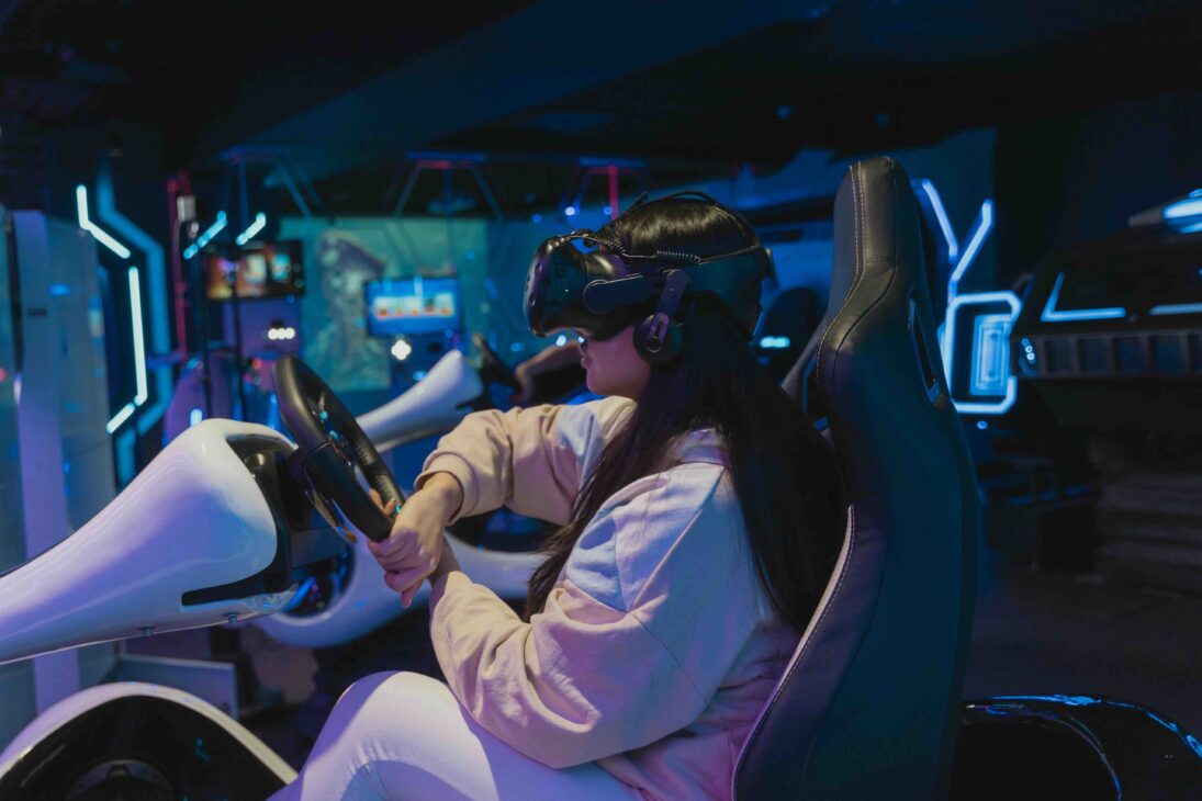 A Girl with a VR-set stirring a wheel in an Immersive Game Room